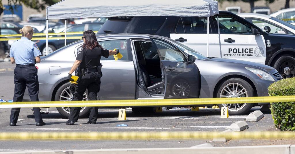 Police investigate a car where a retired Cal State Fullerton administrator was stabbed to death Monday, August 19, 2019 in Fullerton, Calif. The stabbing happened in Parking Lot S at College Place and Langsdorf Drive in Fullerton. (Paul Bersebach/The Orange County Register via AP)