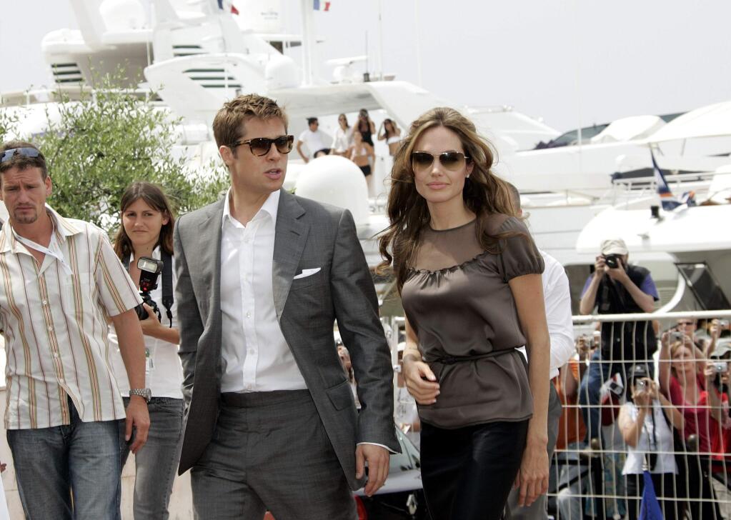FILE - In this May 21, 2007 file photo, American actor-producer Brad Pitt, left, and American actress Angelina Jolie arrive for a photo call for the film 'A Mighty Heart,' at the 60th International film festival in Cannes, southern France. Angelina Jolie Pitt has filed for divorce from Brad Pitt, bringing an end to one of the world's most star-studded, tabloid-generating romances. An attorney for Jolie Pitt, Robert Offer, said Tuesday, Sept. 20, 2016, that she has filed for the dissolution of the marriage. (AP Photo/Virginia Mayo, File)