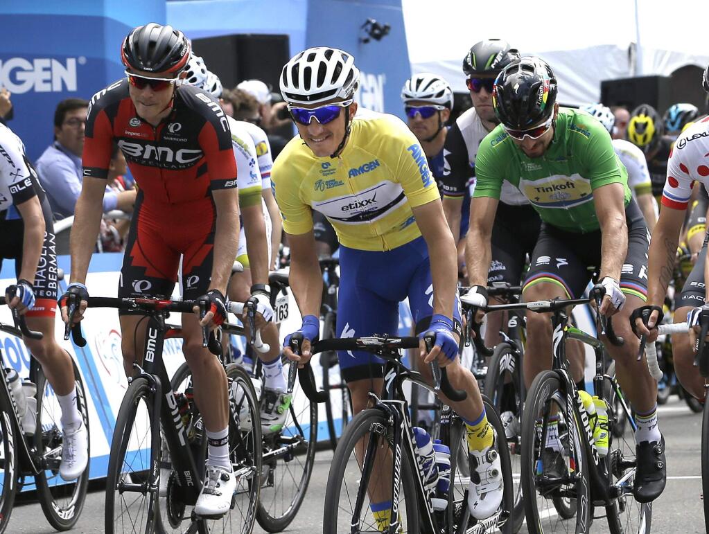 Wearing the yellow jersey, overall leader Julian Alaphilippe, of France, leads the pack as they begin the final stage of the Tour of California cycling race Sunday, May 22, 2016, in Sacramento, Calif. (AP Photo/Rich Pedroncelli)