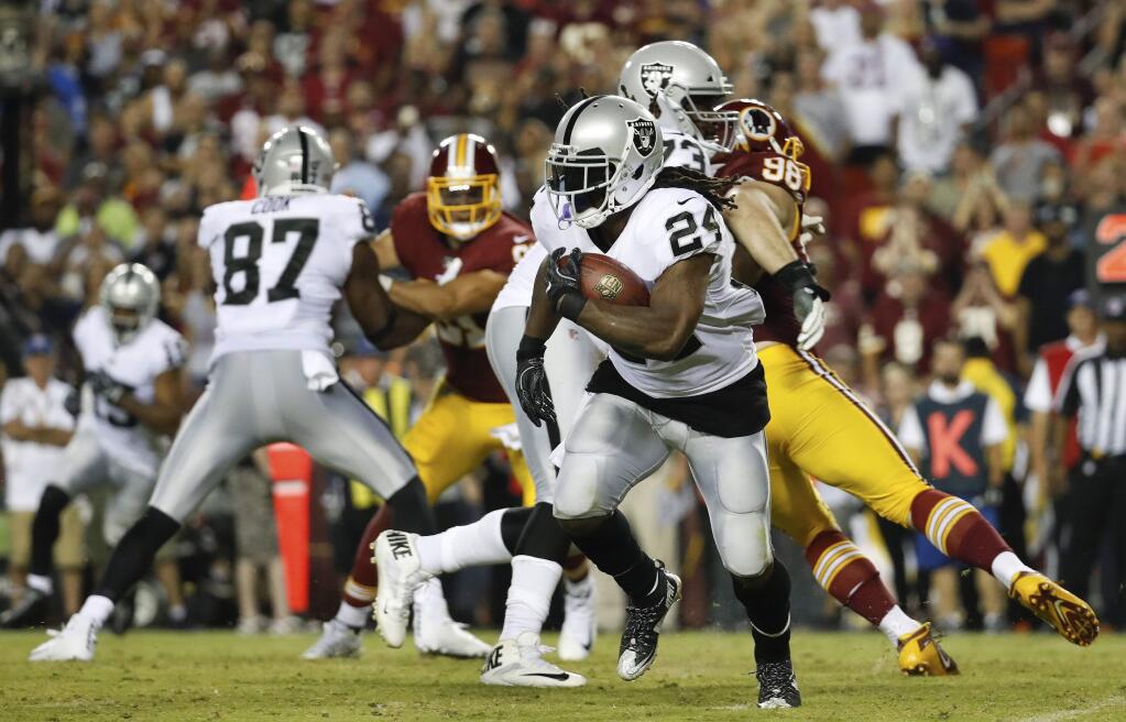 In this Sunday, Sept. 24, 2017, file photo, Oakland Raiders running back Marshawn Lynch (24) carries the ball during the second half against the Washington Redskins in Landover, Md. The Raiders' running game hasn't gotten off the ground the past two games despite one of the NFL's top lines and Marshawn Lynch. (AP Photo/Alex Brandon, File)