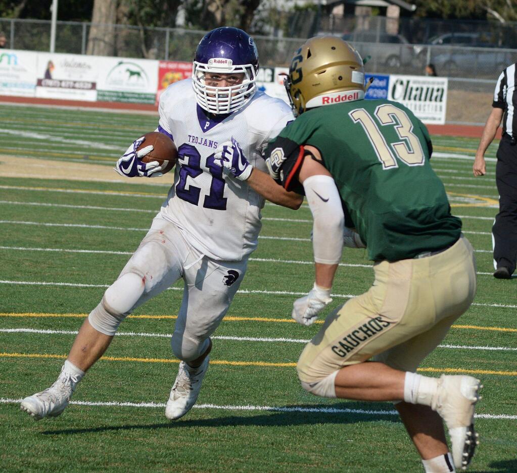 SUMNER FOWLER/FOR THE ARGUS-COURIERPetaluma's Jacob Rollstin (21) and Casa Grande's Jack Leonetti (13) went head-to-head in the Egg Bowl and came away respecting the other team and the game.