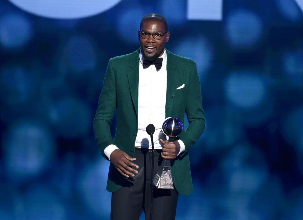 Kevin Durant accepts the award for best male athlete at the ESPY Awards at the Nokia Theatre on Wednesday, July 16, 2014, in Los Angeles. (Photo by John Shearer/Invision/AP)