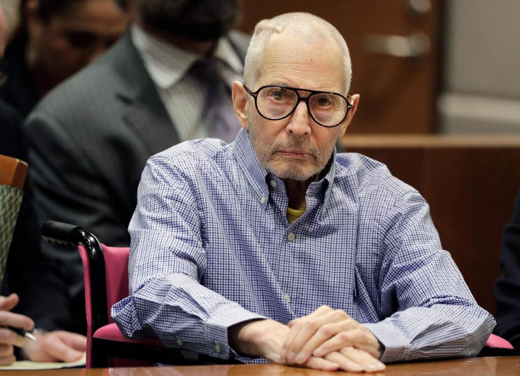 FILE - In this Dec. 21, 2016 file photo, Robert Durst sits in a courtroom in Los Angeles. The New York real estate heir has been scheduled to go on trial in late summer on charges of killing a friend in Los Angeles nearly two decades ago. The Los Angeles Times reports a judge on Tuesday, Jan. 15, 2019, scheduled the trial to begin Sept. 3. (AP Photo/Jae C. Hong, Pool, File)
