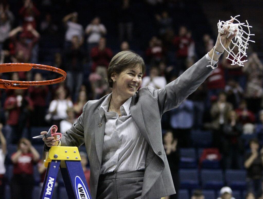 FILE - In this March 30, 2009, file photo, Stanford coach Tara VanDerveer cuts down the net after Stanford defeated Iowa State 74-53 to advance to the Final Four during a women's NCAA tournament regional championship college basketball game in Berkeley, Calif. On Friday night when No. 8 Stanford hosts USC, Vanderveer is poised to become just the second NCAA women's coach to enter the 1,000 wins club, alongside the late Pat Summitt. (AP Photo/Marcio Jose Sanchez, File)