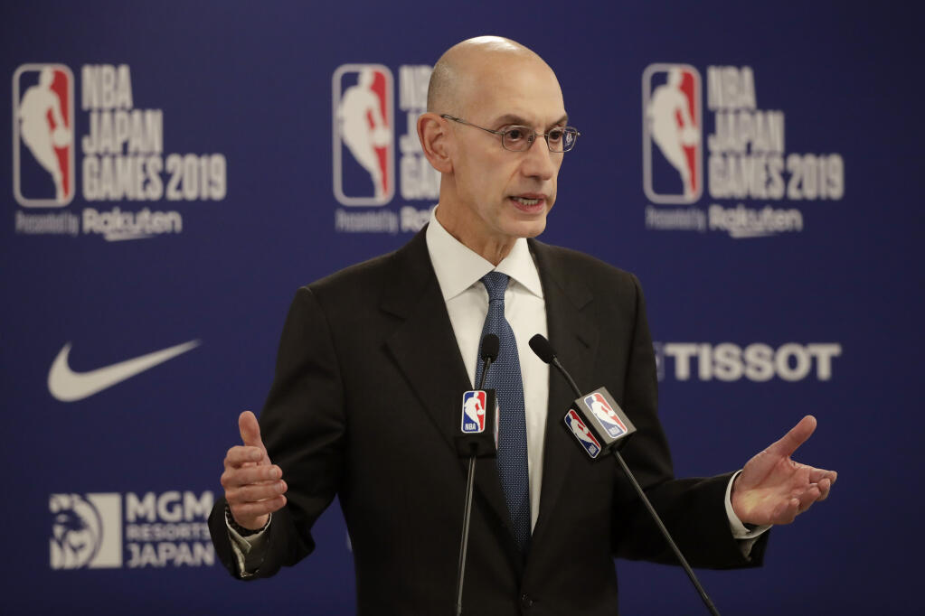 In this Oct. 8, 2019, file photo, NBA Commissioner Adam Silver speaks at a news conference before a preseason game between the Houston Rockets and the Toronto Raptors in Saitama, near Tokyo. (Jae C. Hong / Associated Press)