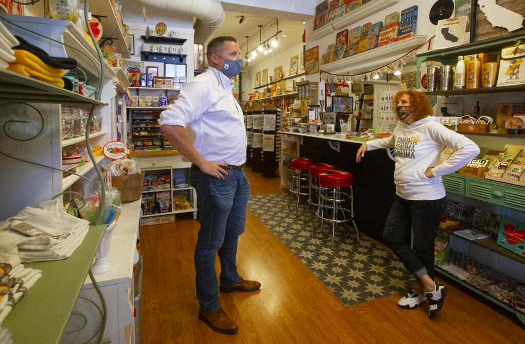 Mark Bodenhamer, CEO of the Sonoma Valley Chamber of Commerce, chats with Heidi Geffen, proprietor of Tiddle E. Winks Vintage 5 & Dime on East Napa Street on Thursday, April 8, 2021. (Photo by Robbi Pengelly/Index-Tribune)