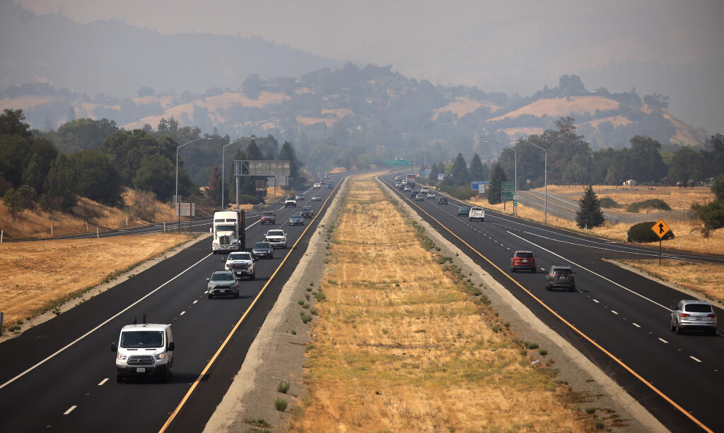 Smoke from fires in far Northern California settles in over Cloverdale and Highway 101 on Aug. 6. (KENT PORTER / The Press Democrat)