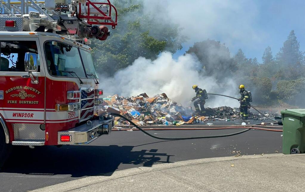 Sonoma County Fire District crews mop up a load of burning garbage on Tuesday, Aug. 9, 2022. (Sonoma County Fire District)