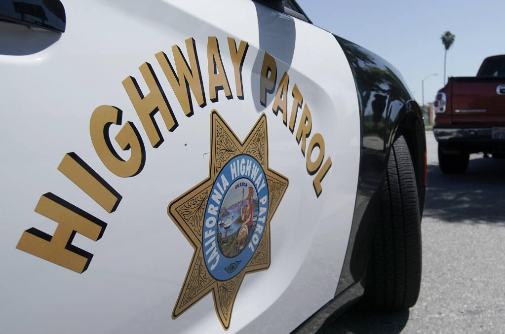 In this Jul. 16, 2020, file photo, a California Highway Patrol stops a motorist along Interstate 5, who is suspected of speeding in Anaheim, California. (Chris Carlson/Associated Press, file)