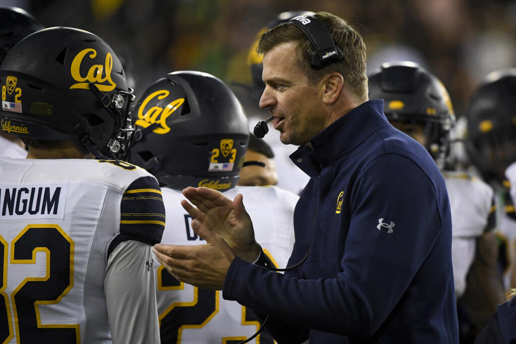 Cal head coach Justin Wilcox encourages his players during the fourth quarter of an October game against Oregon in Eugene. (Andy Nelson / ASSOCIATED PRESS)