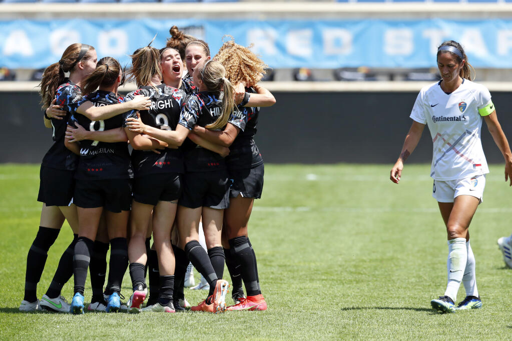 Chicago Red Stars players celebrate after scoring a goal against North Carolina Courage during the first half of a NWSL soccer match, Saturday, June 5, 2021, in Bridgeview, Ill. (AP Photo/Shafkat Anowar)