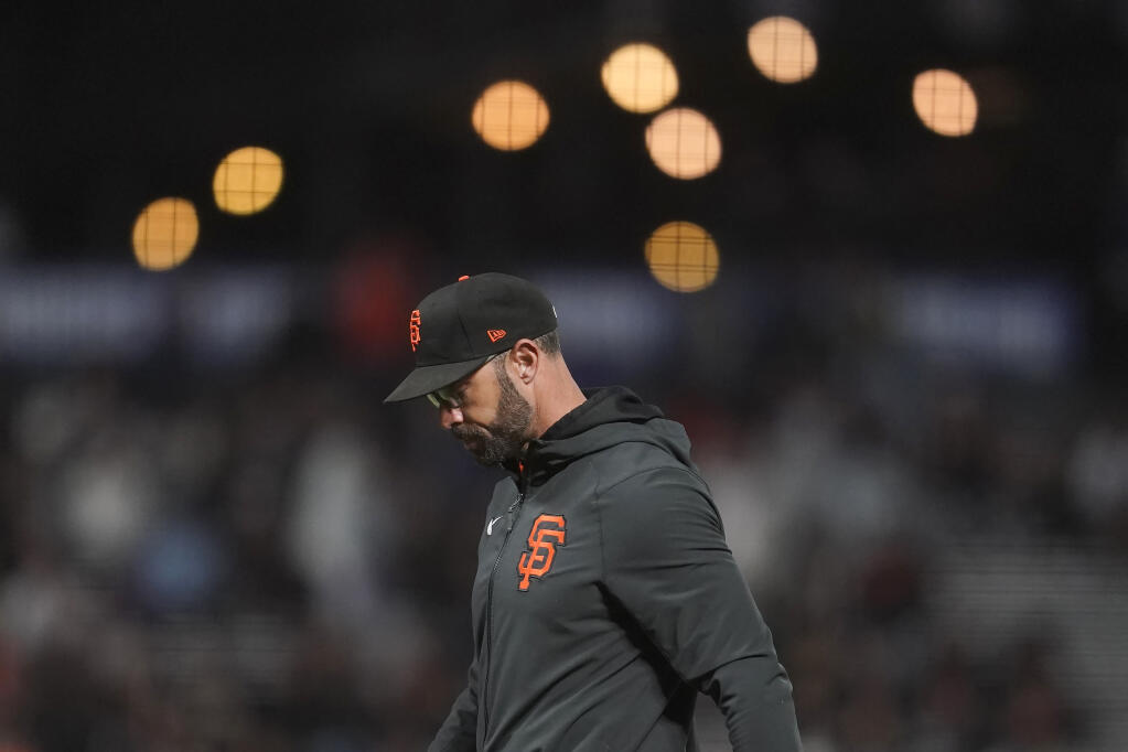San Francisco Giants manager Gabe Kapler walks to the dugout after making a pitching change during the eighth inning of his team's baseball game against the New York Mets in San Francisco, Monday, May 23, 2022. (AP Photo/Jeff Chiu)