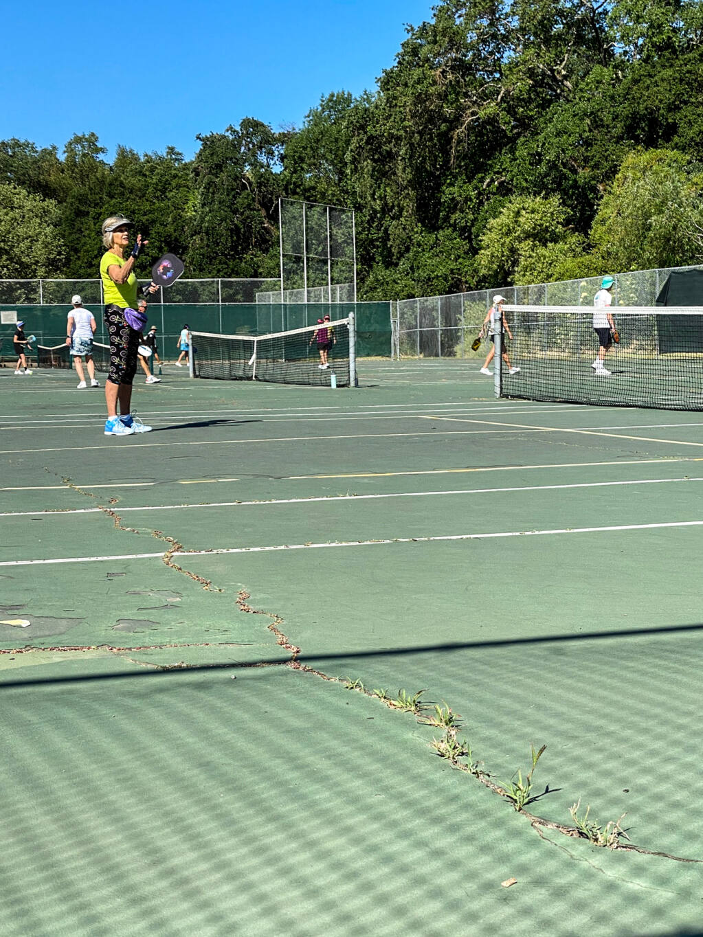 Cracks run through the tennis/pickleball courts at Larson Park in the Springs. (Index-Tribune photo)