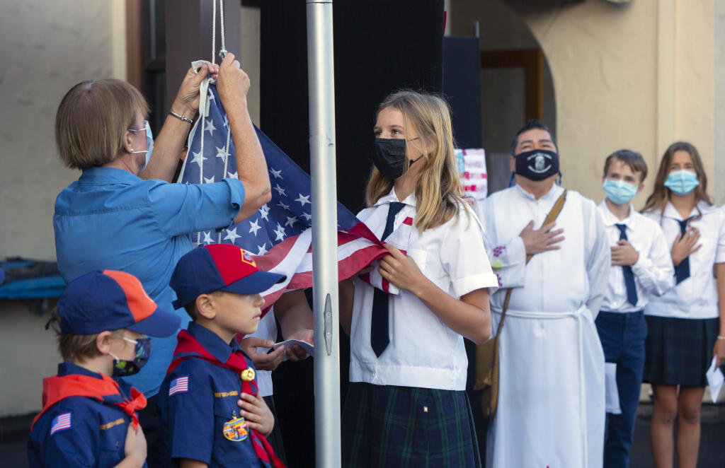 The American flag was raised at the beginning of a brief ceremony at the St. Francis Solano School on West Napa Street, in remembrance of those who perished in the Sept. 11, 2001 terrorist attacks. The ceremony took place on the school grounds on Friday, Sept. 10, 2021. (Photo by Robbi Pengelly/Index-Tribune)