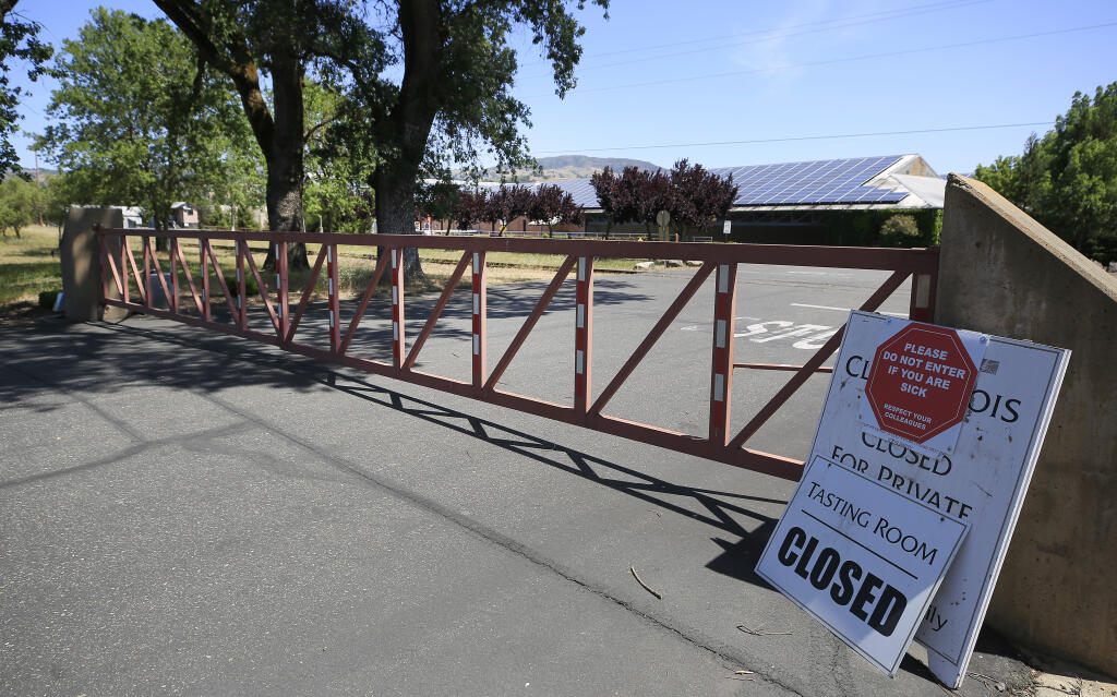The main gate in to Clos du Bois is locked, Saturday, May 8, 2021 in Geyserville, after the company laid off nearly all of their 37 employees. (Kent Porter / The Press Democrat) 2021