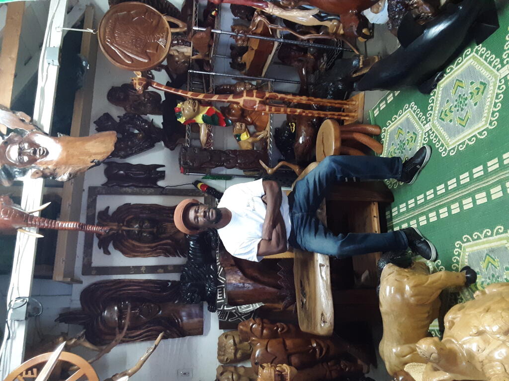 Originally from Jamaica, Vincent S. Malcom of Santa Rosa, shown in his studio, specializes in black walnut and other wood carvings. (Veronica Cruz)