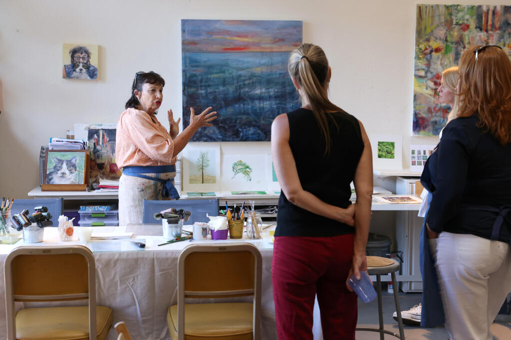 Artist Nancy Willis talks to a group about printmaking at her studio in Napa, Monday, July 24, 2023. (Beth Schlanker / The Press Democrat)