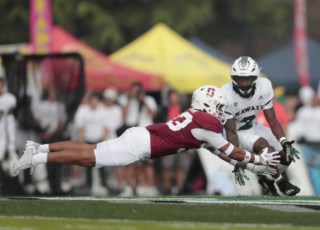 Stanford safety Alaka’i Gilman almost comes up with an interception on a pass intended for Hawaii running back Tylan Hines during the first half Friday, Sept. 1, 2023, in Honolulu. (Jamm Aquino / Honolulu Star-Advertiser)