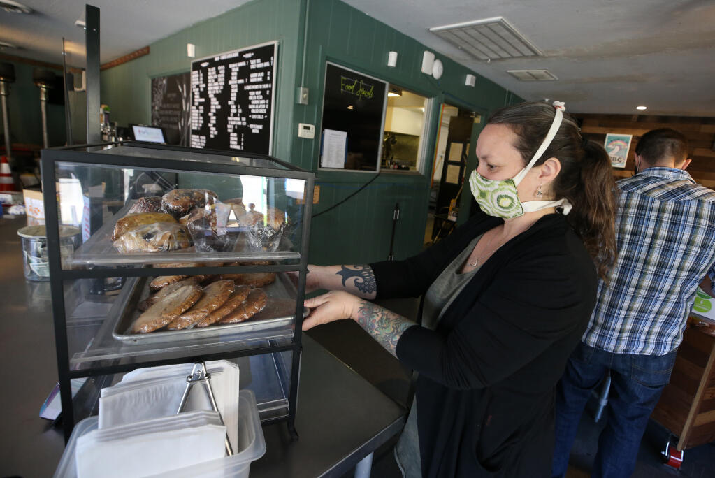 Co-owner Alisse Cottle works at Brew Coffee and Beer House in Santa Rosa, Calif., on Thursday, February 25, 2021. (Beth Schlanker/ The Press Democrat)