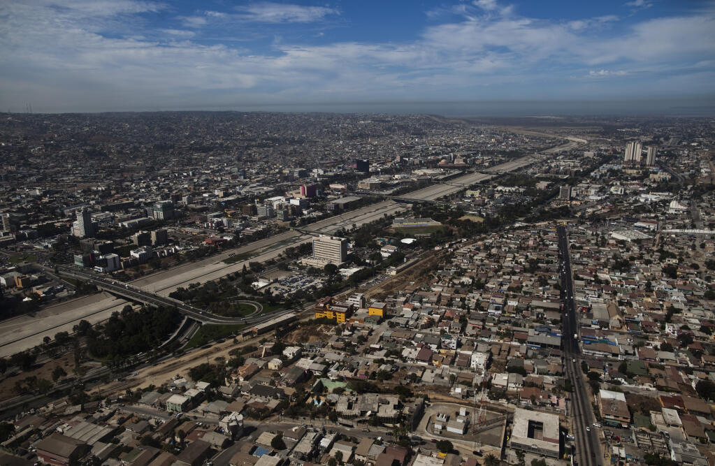 In this Sept. 29, 2010 photo is seen an aerial view of Tijuana, Mexico.  Less than 48 hours after cartel threats and a wave of vehicle fires effectively shut down Tijuana, businesses were open and residents could be seen going about their day in an apparent return to normalcy. (AP Photo/Guillermo Arias)