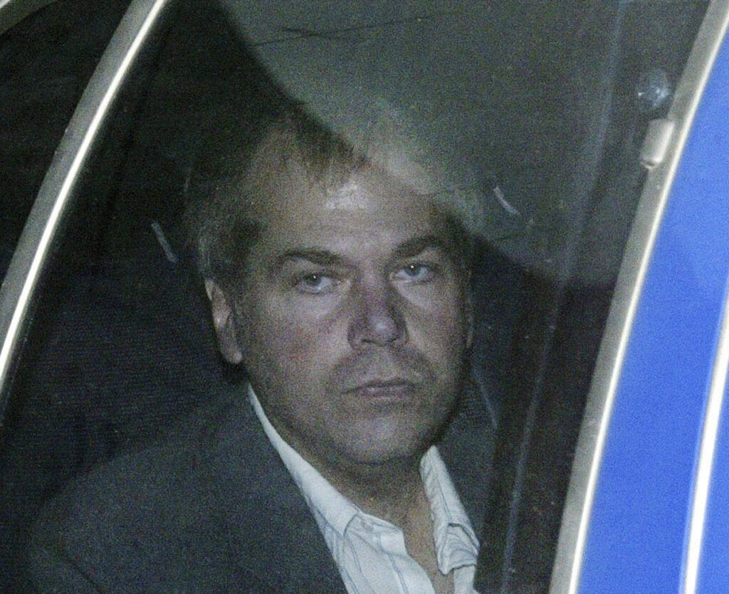 FILE - In this Nov. 18, 2003, file photo, John Hinckley Jr. arrives at U.S. District Court in Washington. Hinckley, who tried to assassinate President Ronald Reagan may soon get the most freedom he's had since since the shooting outside a Washington hotel in 1981. A lawyer for Hinckley Jr. and U.S. attorneys are discussing a possible agreement that would substantially reduce the conditions of Hinckley's release from a mental hospital in 2016, according to federal court hearing on Wednesday, Sept. 23, 2020.  (AP Photo/Evan Vucci, File)