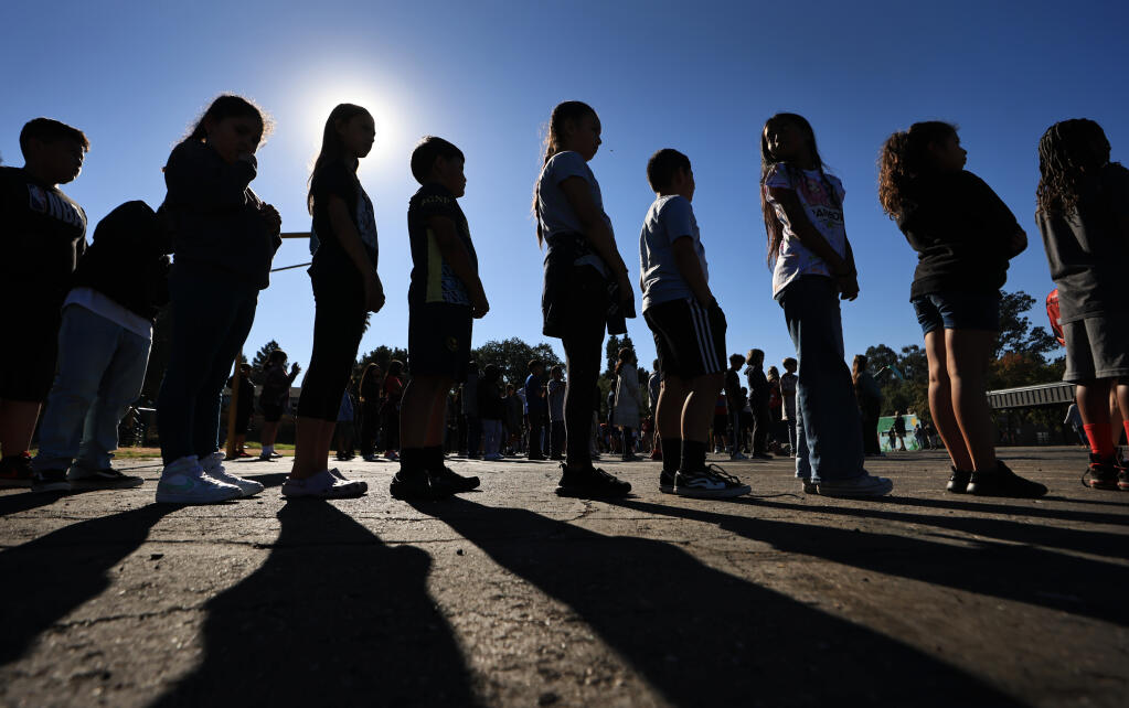 Brook Hill Elementary School students are ushered to the school’s playground after participating in the Great Shakeout, Thursday, Oct. 19, 2023, in Santa Rosa. (Kent Porter / The Press Democrat file)