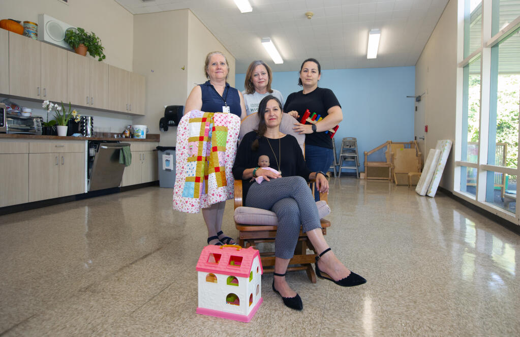Clockwise from top left, Terri Hernandez, Kristi Kucera, Leonela Armenta and Tracy Dorrance in the room on May 27 that once bustled with teen mothers caring for their infants, while attending to their high school  studies. (Photo by Robbi Pengelly/Index-Tribune)