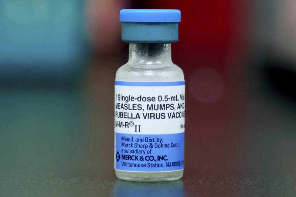 A vial of a measles, mumps and rubella vaccine in Mount Vernon, Ohio, May 17, 2019. According to a report released by the Centers for Disease Control and Prevention on Thursday, April 21, 2022, a smaller portion of U.S. children got routine vaccinations required for kindergarten during the pandemic, raising concerns that measles and other preventable diseases could increase. (AP Photo/Paul Vernon, File)