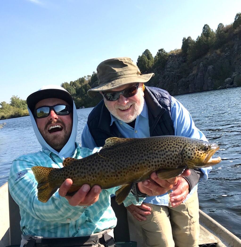 If this photo had sound you’d hear guide Joey Maxim laughing with great joy as he shows off the big trout I landed while fishing with him on the Henry’s Fork River last month. He was every bit as happy as I was. (Photo By Dottie Lynch)