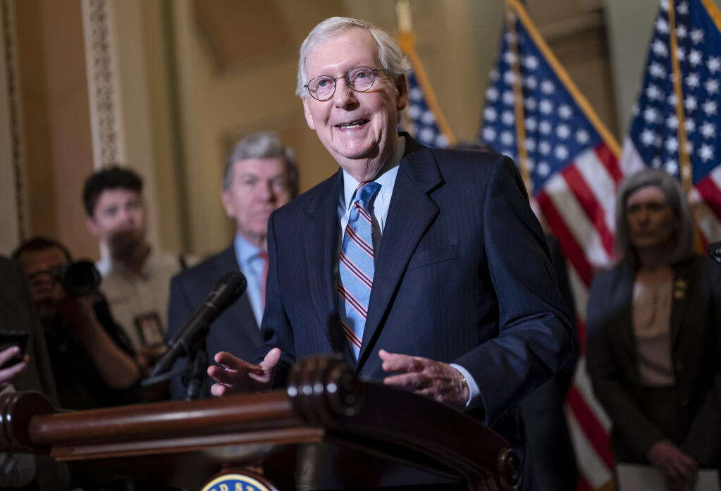 Senate Minority Leader Mitch McConnell, R-Ky., speaks with reporters following a closed-door policy lunch, at the Capitol in Washington, Tuesday, June 14, 2022. (AP Photo/J. Scott Applewhite)