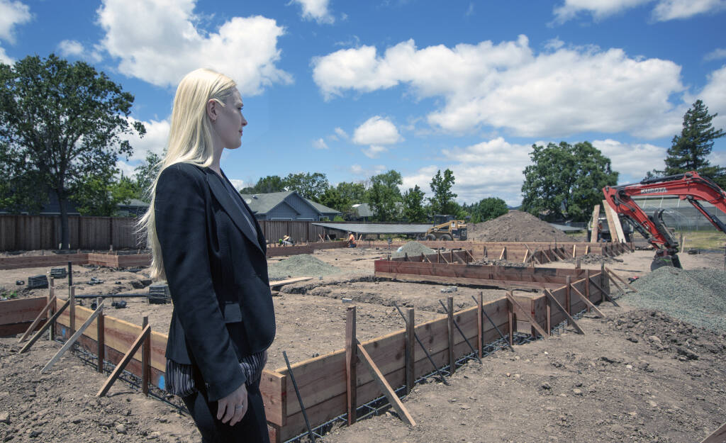 Sweetwater Spectrum Executive Director Olivia Vain looks over the new construction that will add four more residences for adults with autism, on Friday, June 17, 2022. (Robbi Pengelly/Index-Tribune)