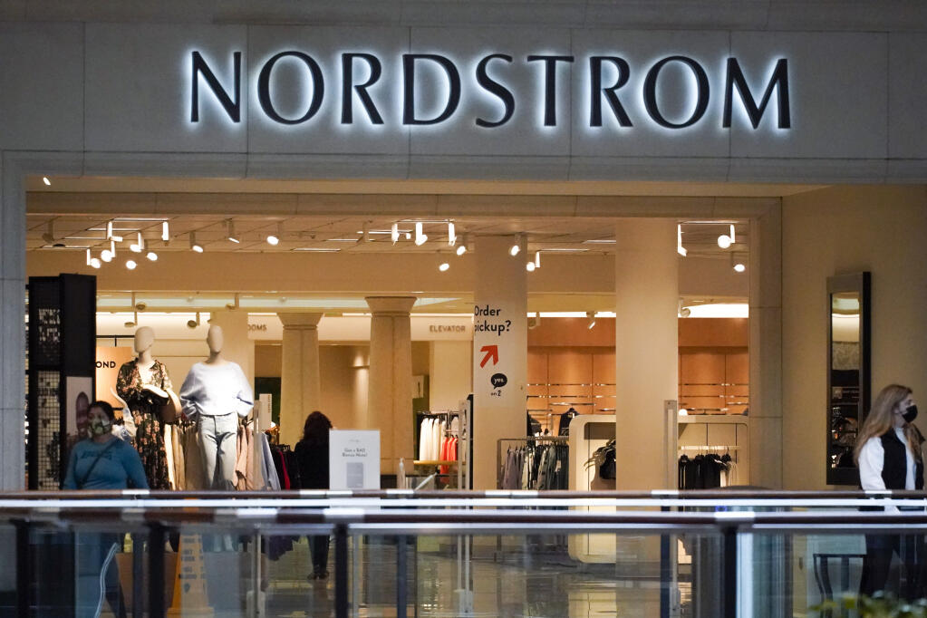 Shoppers walk near an entrance to a Nordstrom store at a shopping mall in Pittsburgh. A Nordstrom in Walnut Creek was ransacked on Saturday. (AP Photo/Keith Srakocic)