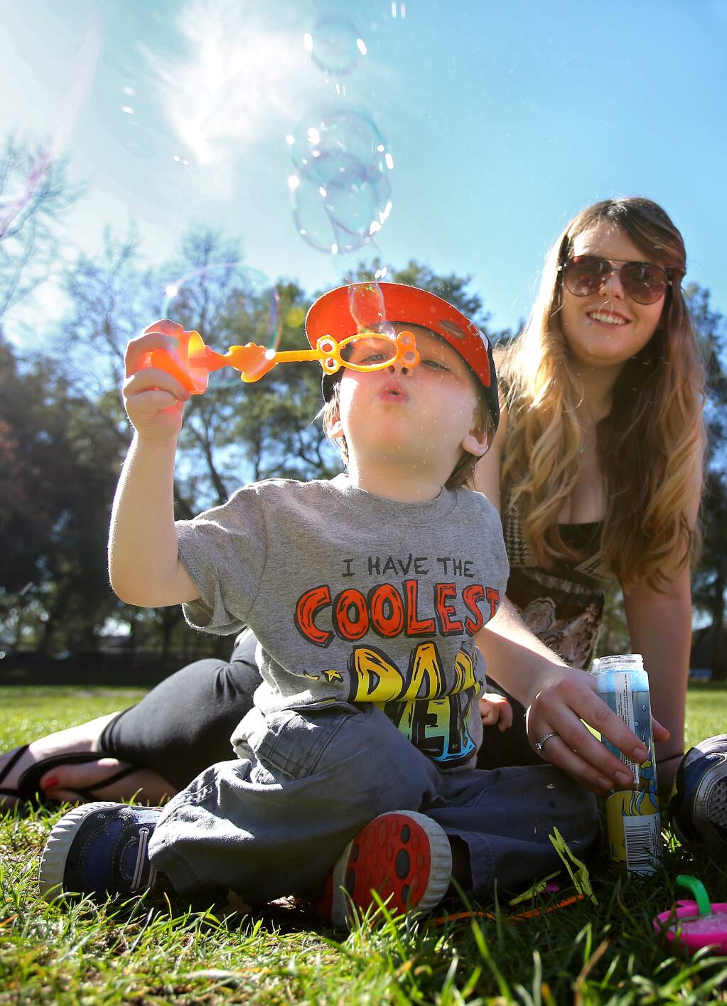 Jack Gless, 2, blows bubbles with his mom, Kelly Pennington, at Howarth Park in Santa Rosa on Wednesday, January 28, 2015. (Christopher Chung/ The Press Democrat)
