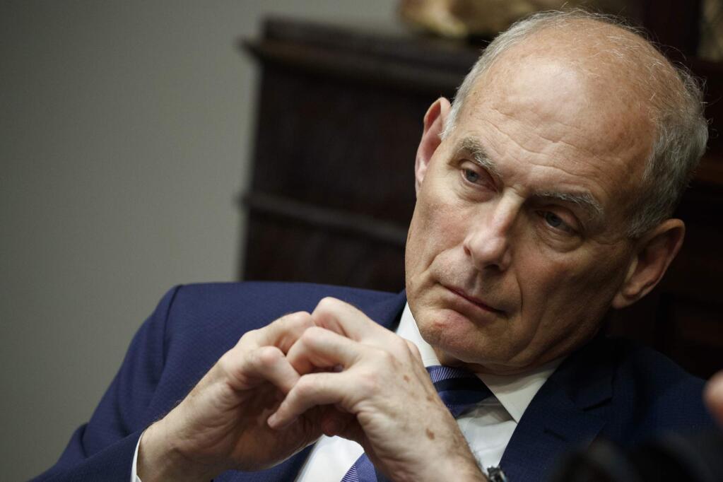 FILE - In this June 21, 2018 file photo, then White House chief of staff John Kelly listens as President Donald Trump speaks during a lunch with governors in the Roosevelt Room of the White House in Washington. Kelly is defending former White House national security aide, Army Lt. Col. Alexander Vindman, who raised concerns about President Donald Trump's phone call with Ukraine's president that spurred his impeachment. Kelly made the comments at a public forum Wednesday evening in Morristown, New Jersey. (AP Photo/Evan Vucci, File)