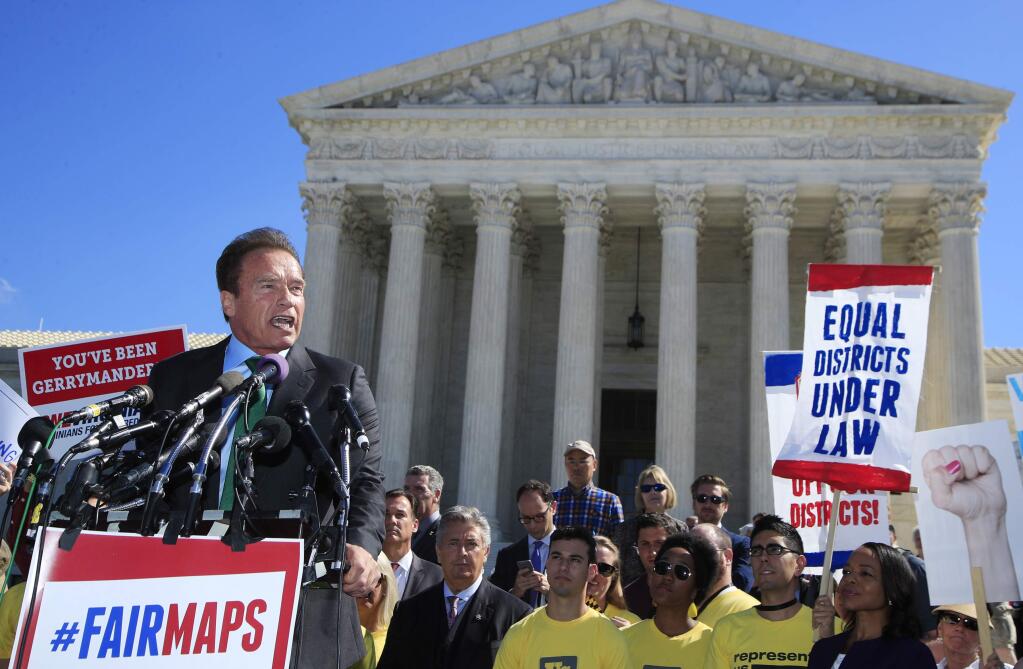 Former California Gov. Arnold Schwarzenegger, a leading supporter of the state's independent redistricting commission, speaks at a rally outside the U.S. Supreme Court in Washington on Tuesday. The court heard arguments in a case challenging partisan gerrymandering of legislative districts. (MANUEL BALCE CENETA / Associated Press)