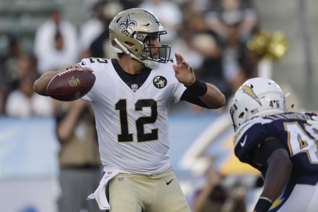 New Orleans Saints quarterback Tom Savage throws a pass during the second half of a preseason game against the Los Angeles Chargers Saturday, Aug. 25, 2018, in Carson. (AP Photo/Marcio Jose Sanchez)