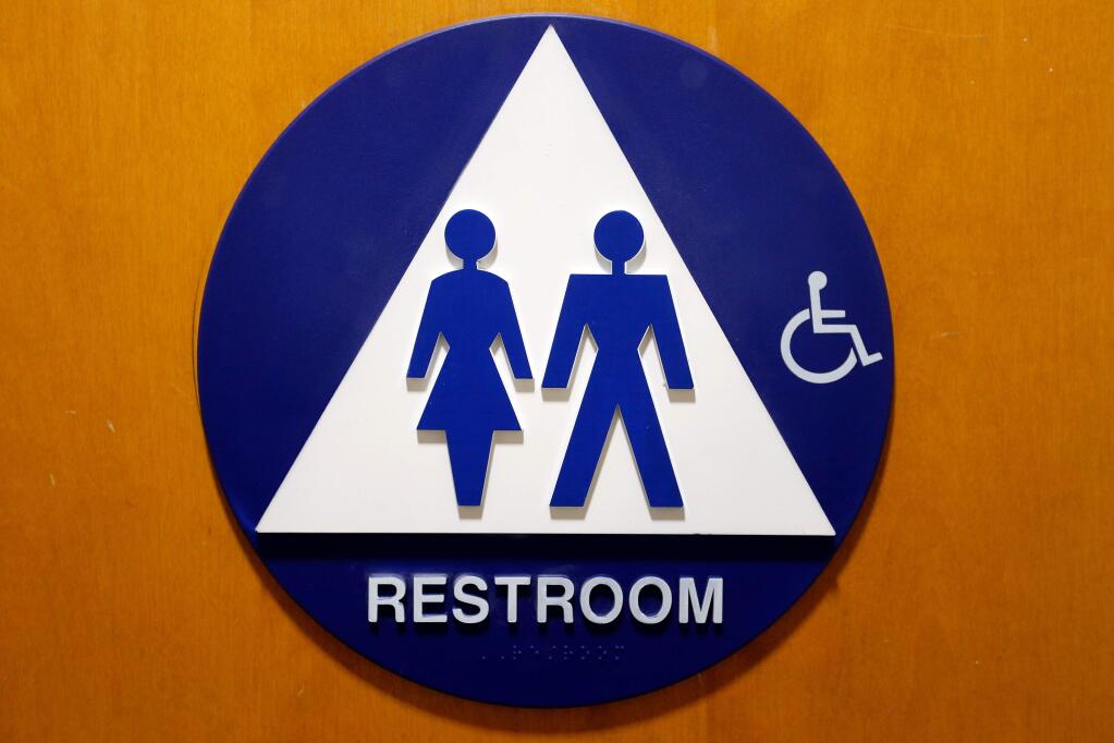 A unisex restroom at the Sonoma County administration center in Santa Rosa, California on Wednesday, December 28, 2016. A new state law requres single-toilet restrooms to be designated as gender neutral or unisex restrooms. (Alvin Jornada / The Press Democrat)