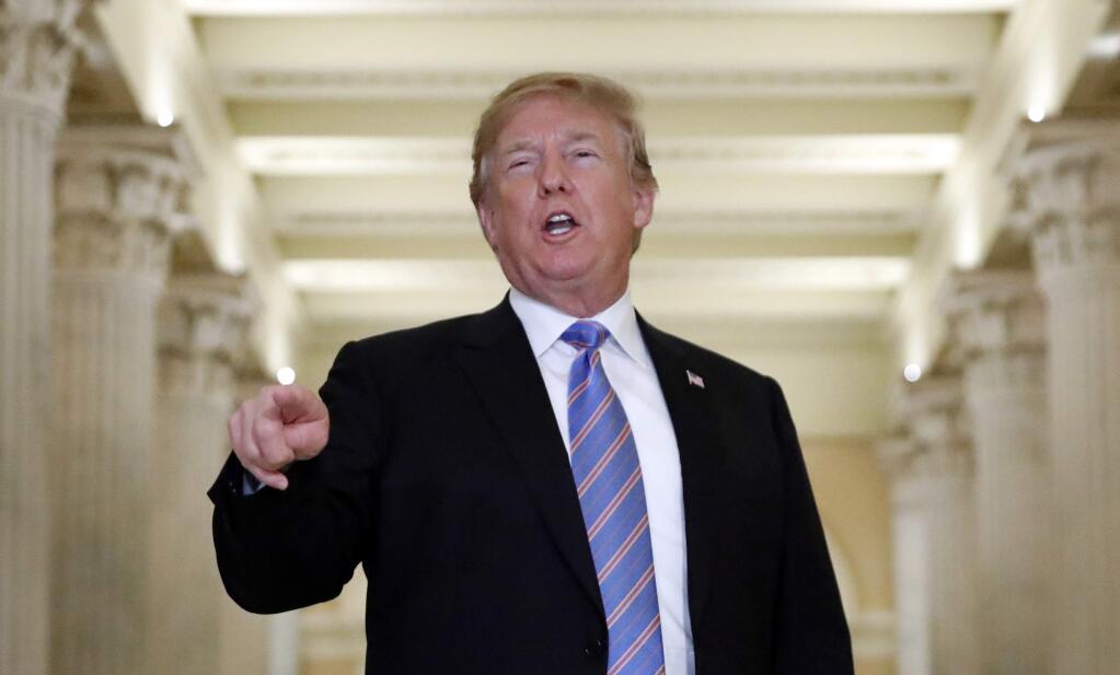 President Donald Trump speaks in the Hall of Columns as he arrives on Capitol Hill in Washington, Tuesday, June 19, 2018, to rally Republicans around a GOP immigration bill. (AP Photo/Alex Brandon)