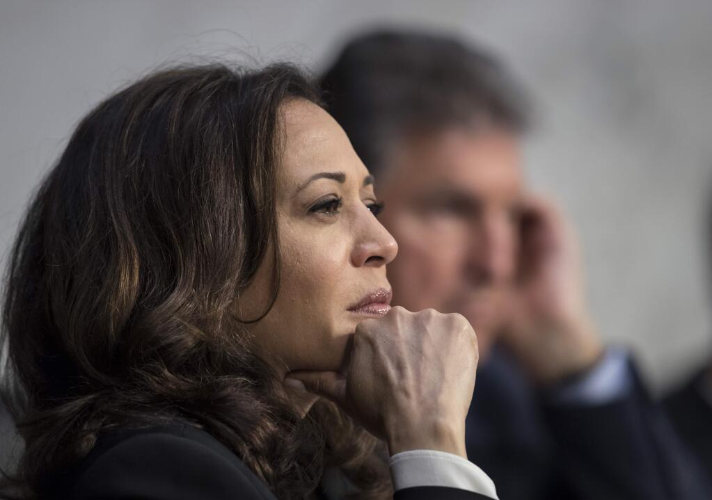 Sen. Kamala Harris, D-Calif., listens to testimony from top national security chiefs during a Senate Select Committee on Intelligence hearing on gathering intelligence on foreign agents, on Capitol Hill in Washington, Wednesday, June 7, 2017. Intelligence Committee Chairman Sen. Richard Burr, R-N.C., suspended Harris from further questioning of Deputy Attorney General Rod Rosenstein after she interrupted his answers. (AP Photo/J. Scott Applewhite)