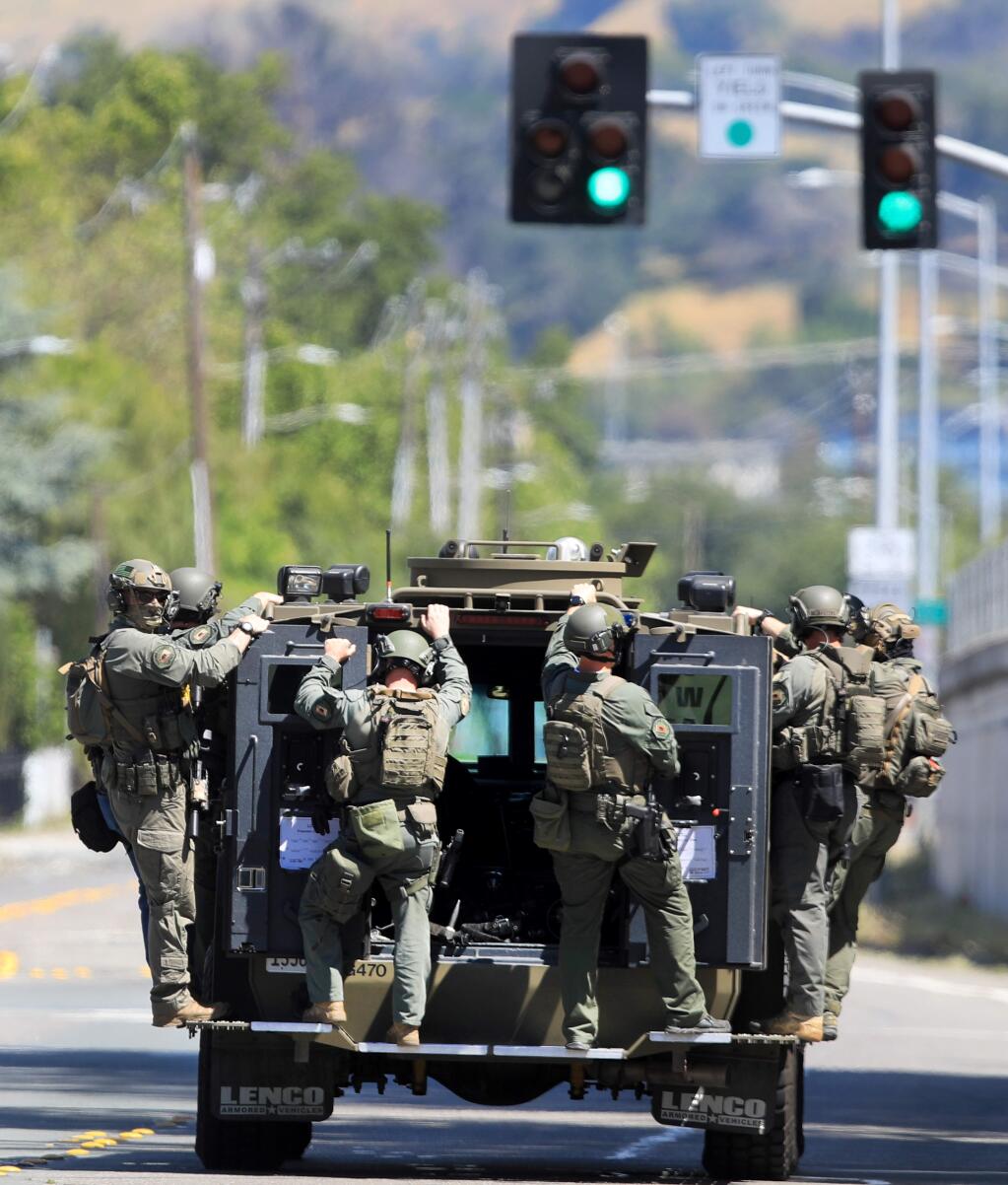After searching a house on Cleveland Ave., Friday, May 15, 2020 in Santa Rosa, deputies with the Sonoma County Sheriff's Department leave the scene. The search was related to a gang related shooting Thursday night at Andy's Unity Park on Mooreland Ave. (Kent Porter / The Press Democrat) 2020