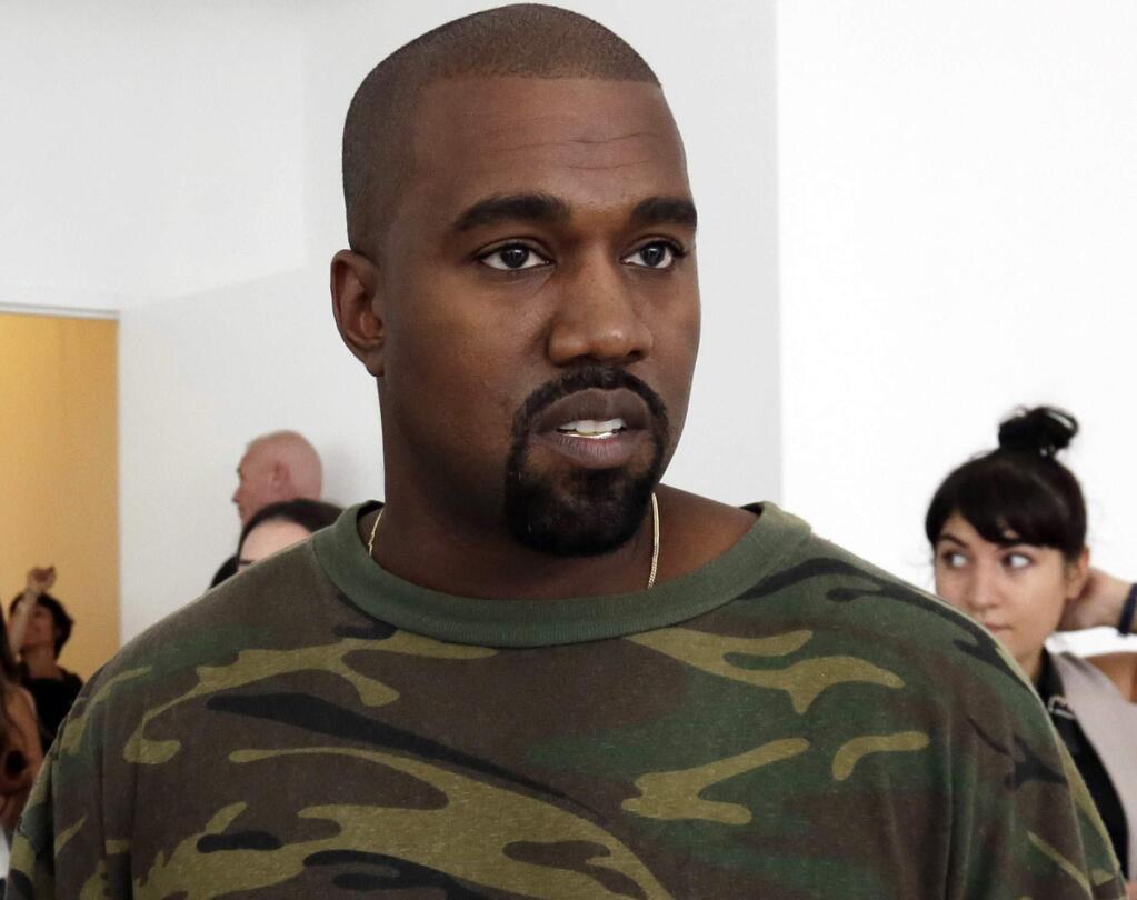 FILE - In this Sept. 10, 2015 file photo, Kanye West appears at the Brother Vellies Spring 2016 collection presentation during Fashion Week, in New York. West was silent when it comes to whether he thinks President Donald Trump cares for black people. West appeared on ABC's 'Jimmy Kimmel Live' on Thursday, Aug. 10, 2018. West discussed his support for Trump and questioned why people go after the president instead of trying 'love.' However, West did not answer when Kimmel asked if the rapper thought Trump cares about black people, or any people at all. (AP Photo/Richard Drew, File)