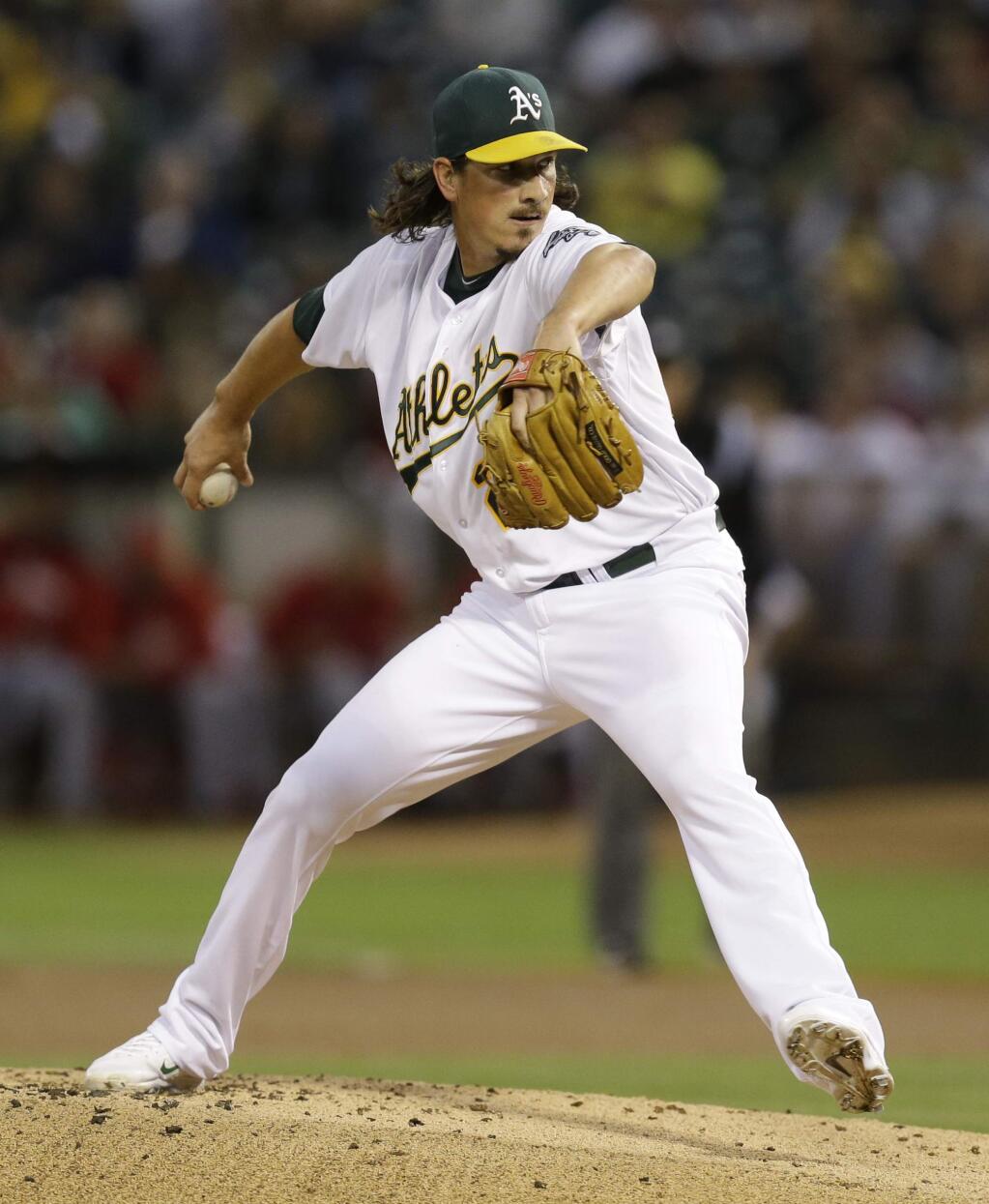 Oakland Athletics' Jeff Samardzija works against the Los Angeles Angels in the first inning of a baseball game Monday, Sept. 22, 2014, in Oakland, Calif. (AP Photo/Ben Margot)