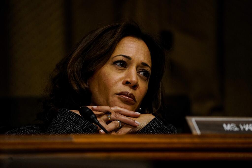 Sen. Kamala Harris listens to comments by Christine Blasey Ford at a Senate Judiciary Committee hearing in September. (MELINA MARA /Washington Post)