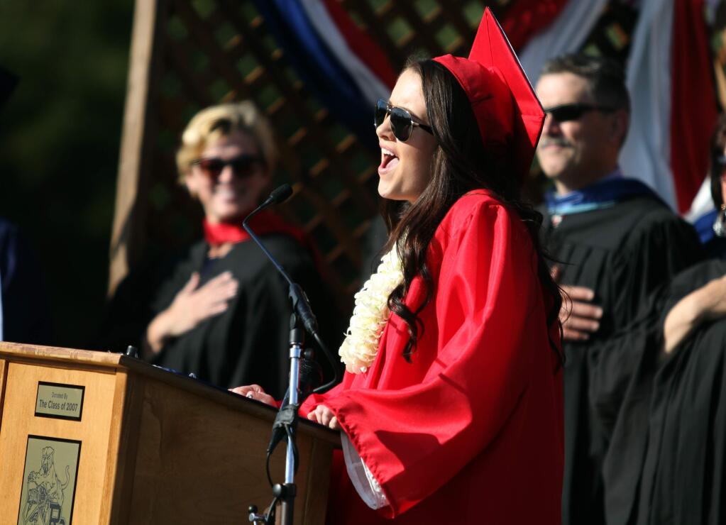 Taylor Timmons sings the National Anthem during the Rancho Cotate High School Graduation Ceremony, Friday, June 5, 2015. (Crista Jeremiason/ The Press Democrat)