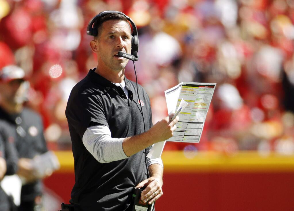 San Francisco 49ers head coach Kyle Shanahan looks at the scoreboard during the second half of an NFL football game against the Kansas City Chiefs in Kansas City, Mo., Sunday, Sept. 23, 2018. (AP Photo/Charlie Riedel)
