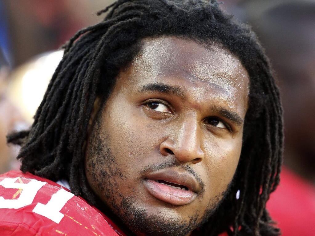 FILE - This Nov. 23, 2014, file photo shows San Francisco 49ers defensive tackle Ray McDonald (91) on the bench during the fourth quarter of an NFL football game in Santa Clara, Calif. (AP Photo/Tony Avelar, File)