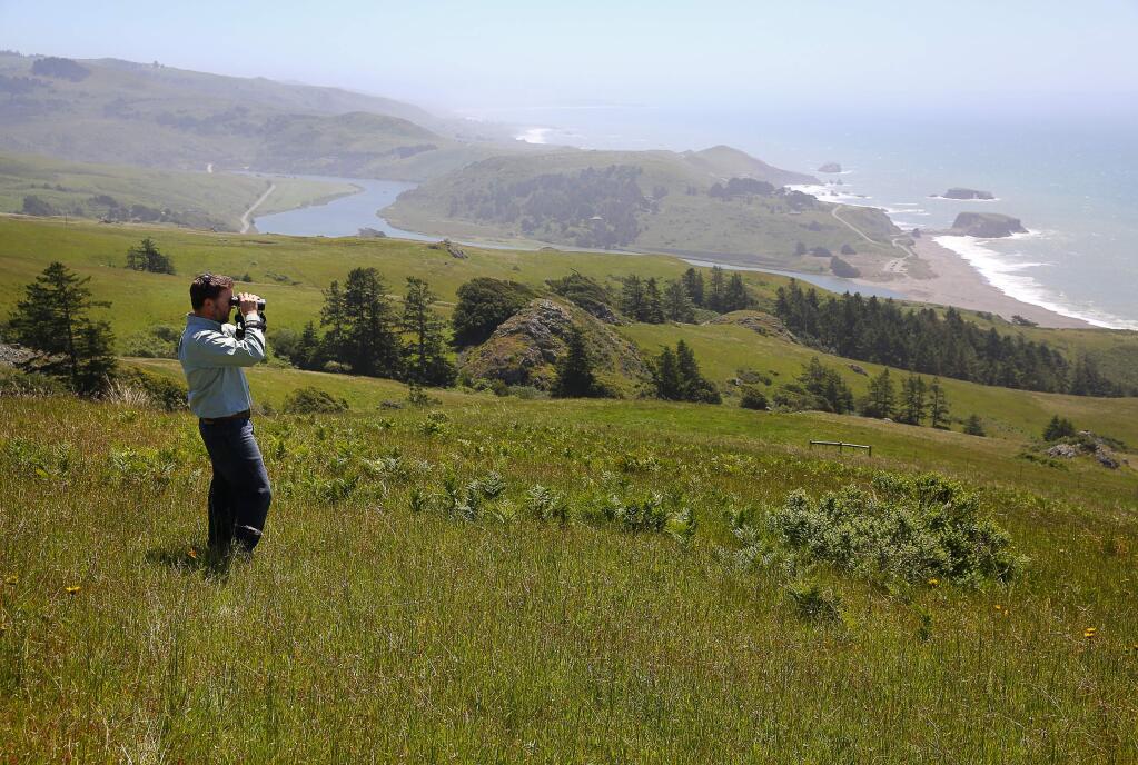 Jenner Headlands Preserve manager Brook Edwards enjoys the view overlooking the coast, in the hills above Jenner, on Thursday, April 28, 2016. (Christopher Chung/ The Press Democrat)