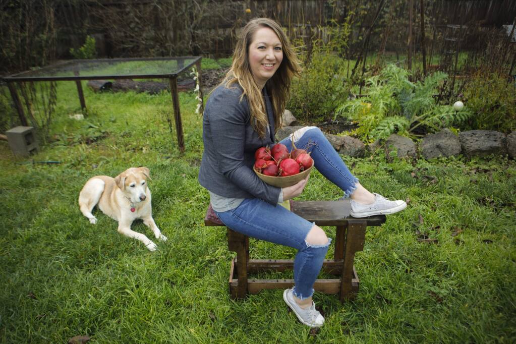 Petaluma, CA, USA. Tuesday, January 03, 2017._ Erin Hines, owner of Bitter Girl Bitters makes small batch bitters that she sells online and directly to distilleries, breweries and bars. She grows the ingredients she uses in her backyard garden. She is a bartender for Campari where she concocts cocktails for the liqueur company.(CRISSY PASCUAL/ARGUS-COURIER STAFF)