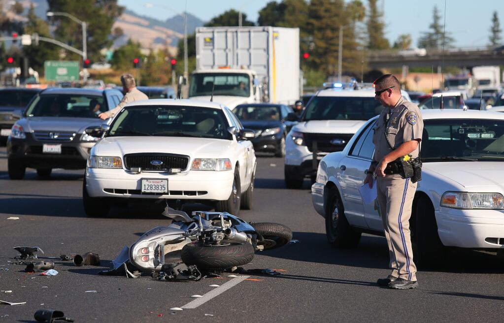 CHP investigate the scene of a crash involving a motorcyclist on northbound Highway 101, north of the Mendocino Avenue onramp, in north Santa Rosa on Tuesday, June 21, 2016. (Christopher Chung/ The Press Democrat)