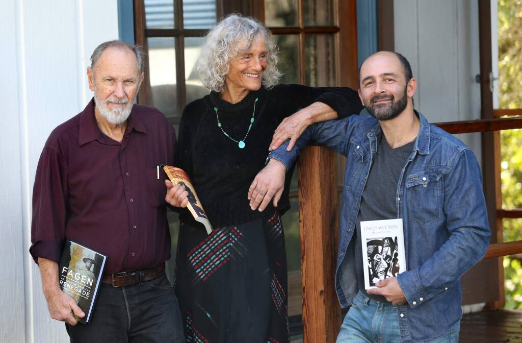 Local authors Michael Morey, left, his wife Barbara Baer, and her son Michael Levitin at their home in Forestville, California on Sunday, February 10, 2019 . (BETH SCHLANKER/The Press Democrat)